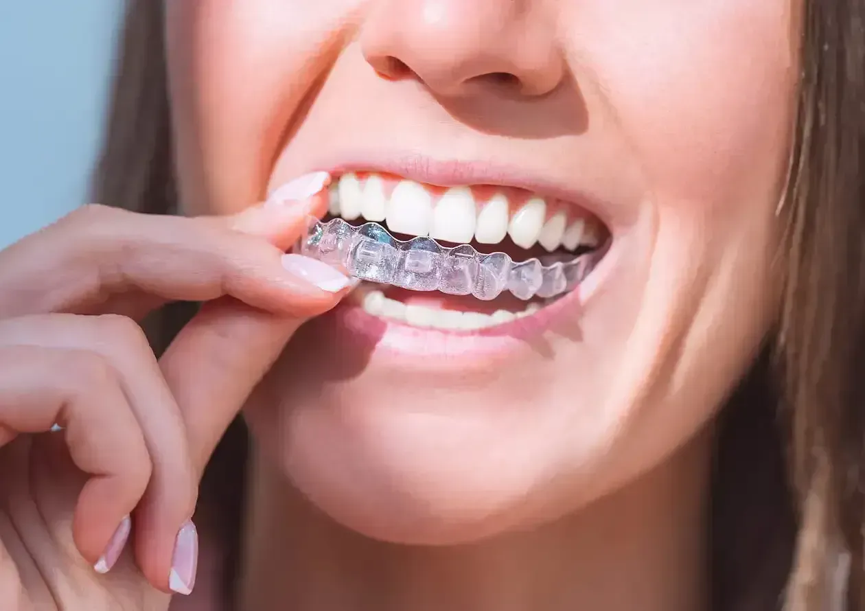 Dentist reviewing a custom Invisalign treatment plan with a patient at a Niles, IL dental clinic